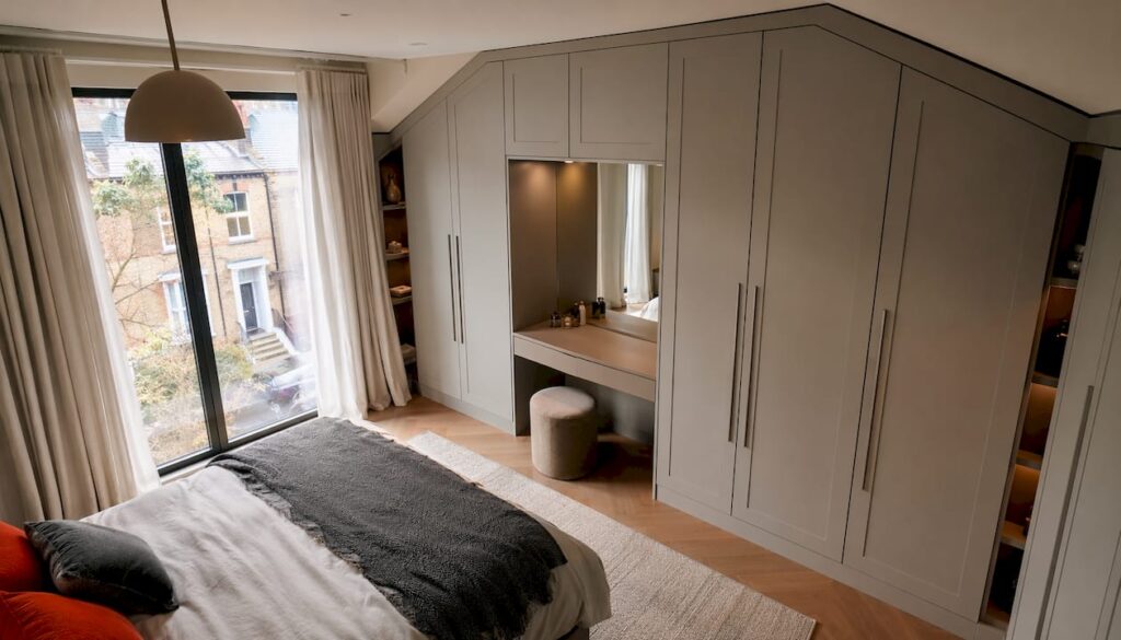 Bespoke fitted wardrobe in London loft room