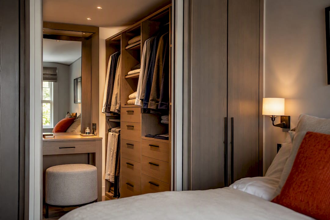 Fitted walk-in wardrobe interior with dressing table