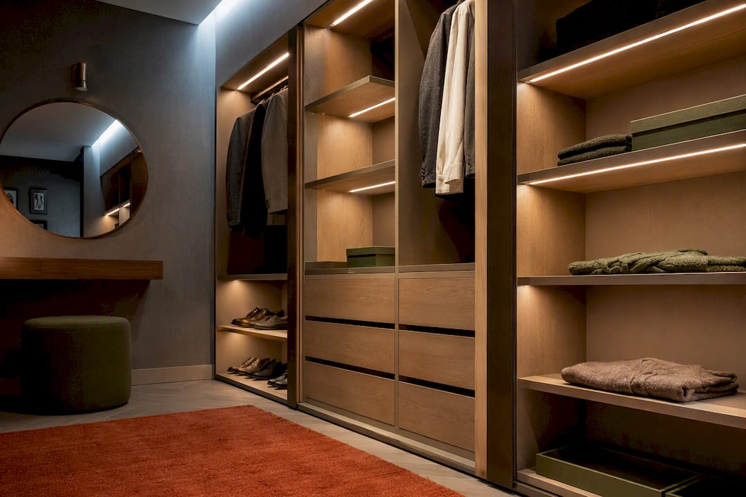 Layered LED lighting inside a fitted wardrobe