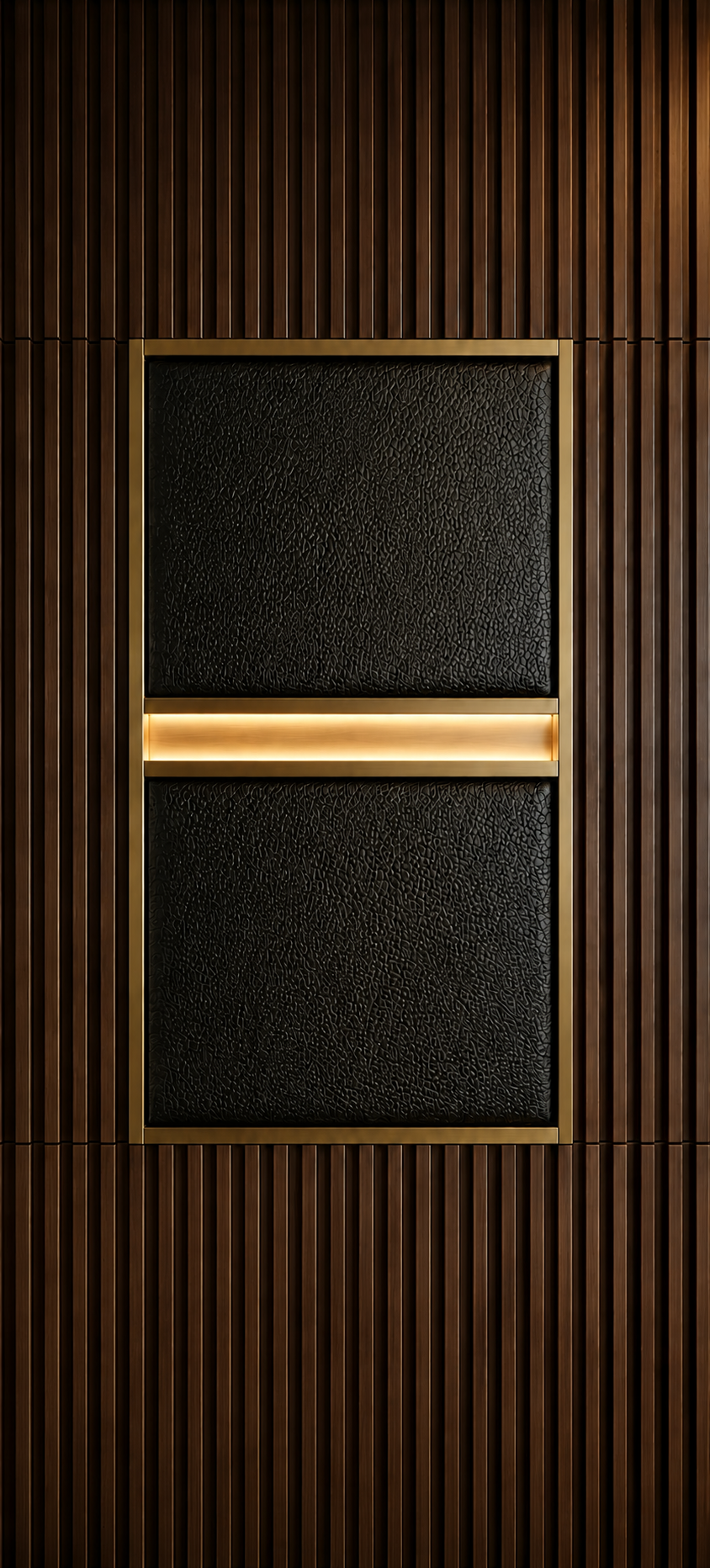 Close-up of bespoke wardrobe craftsmanship with textured black panels, brass framing, warm LED lighting, and fluted walnut detailing.
