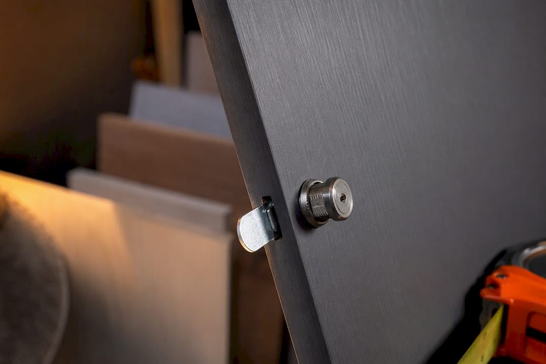 Close-up of wardrobe cam lock fitting
