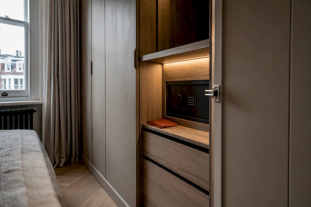 Bespoke wardrobe bay with concealed safe
